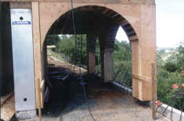 carport with arches framed in-from East.jpg (1131550 bytes)