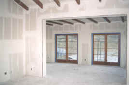 master bedroom and sitting room with drywall installed- from East.jpg (876375 bytes)